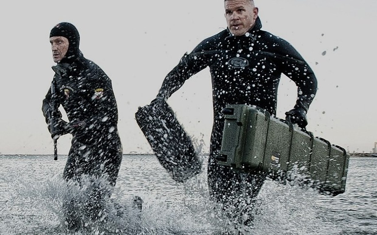 Deployable Systems protective cases carried through surf by divers